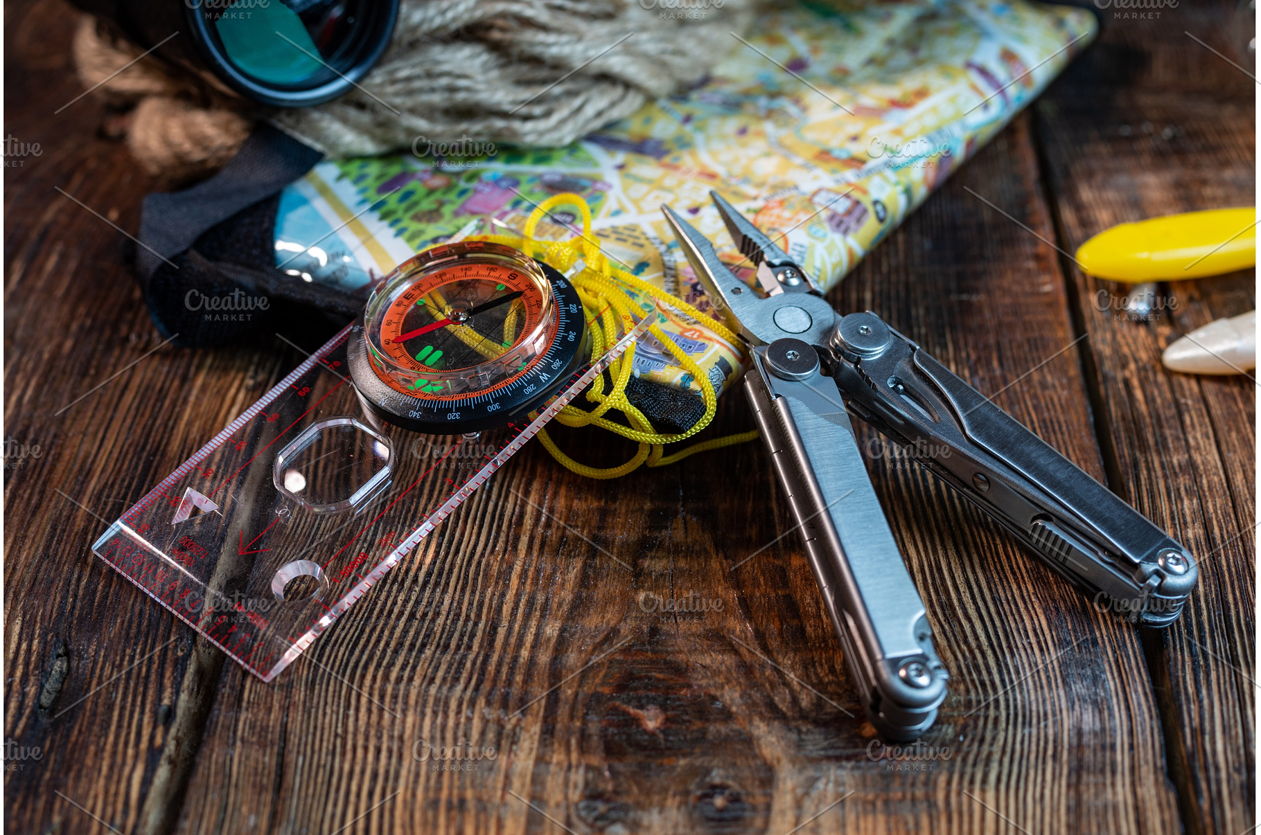 Map, compass and pliers. Orientation, a Sports & Recreation Photo by Stockphoto by vzwer