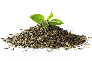 Dry tea leaves and fresh green tea leafs isolated on white background, a Food & Drink Photo by AlyaAnd