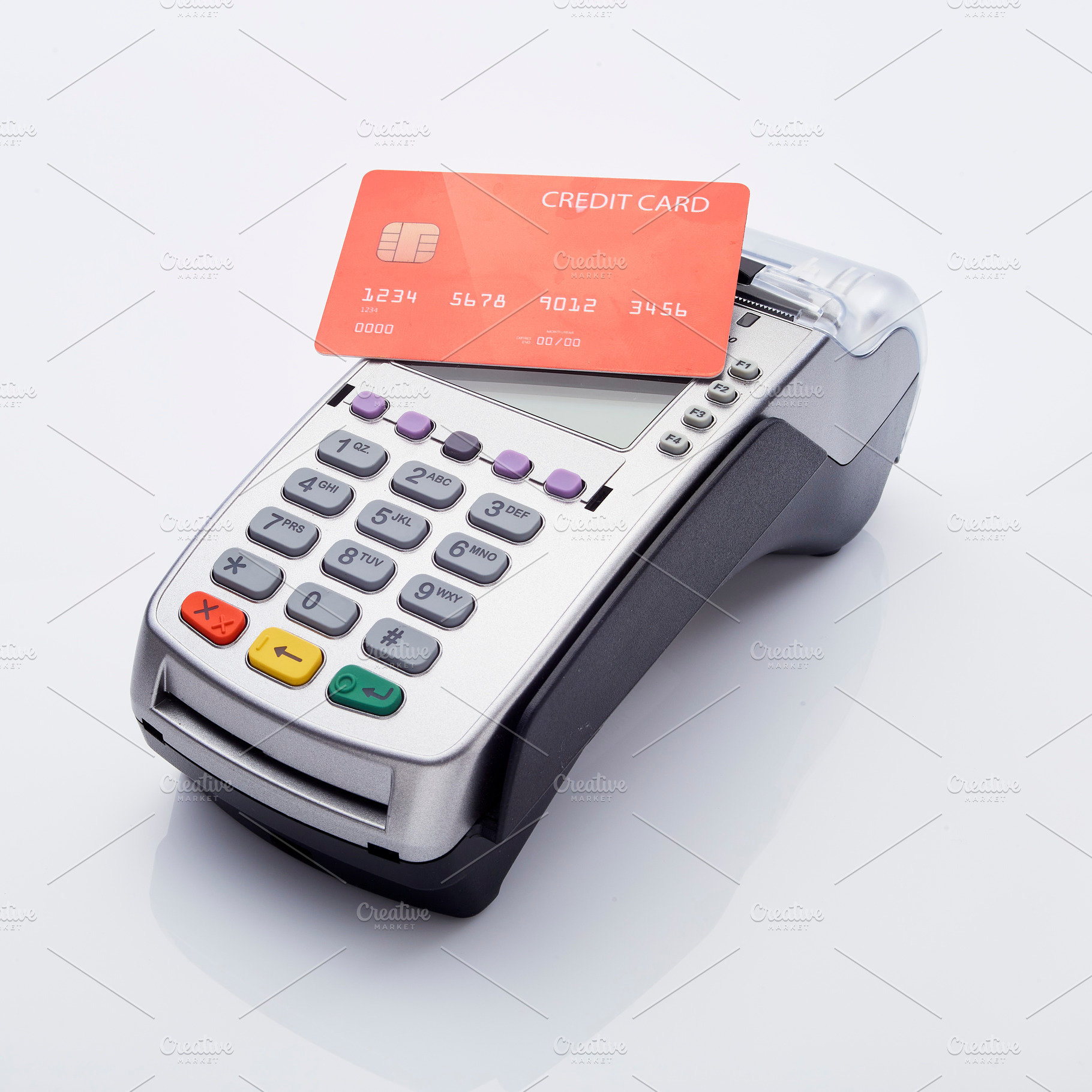 Red Credit card and pos terminal, a Photo by 1981 Rustic studio kan
