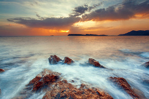 Beautiful seascape at sunset featuring sea, sky, and landscape