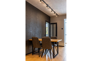 Modern dining area with wooden table, an Architecture Photo by wip3out