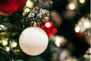 Glittering white ornament hanging on, a Holiday Photo by Anna Efetova