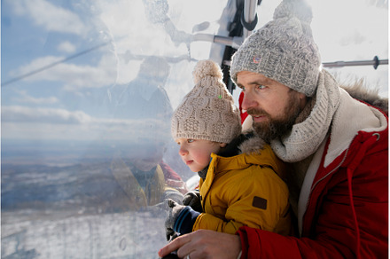 Father and young son on a winter, a Holiday Photo by HalfPoint