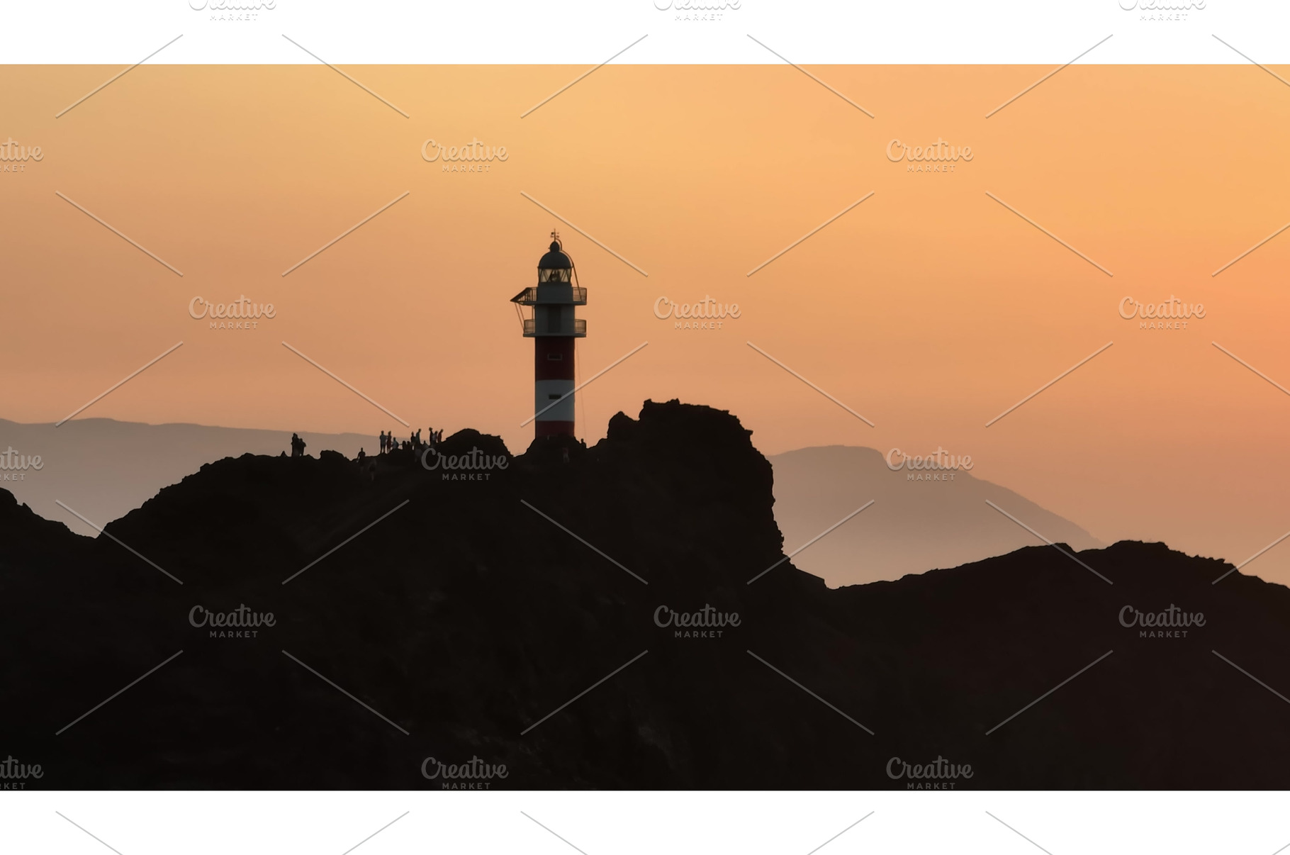 Tourists watching sunset at Faro de, an Architecture Photo by Goinyk