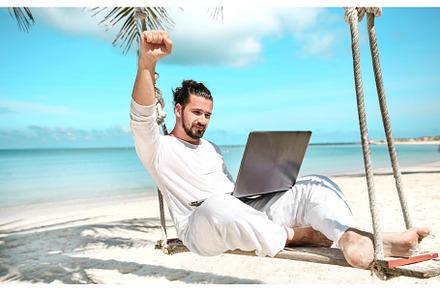 Man working with a laptop on a hammock in the beach show win stock photo, a Holiday Photo by Jyliana's shop