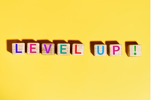 Colorful Level Up text on wooden, a Business Photo by Gladkov photography