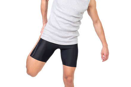 Cheerful sportsman stretching quadriceps muscle, a Sports & Recreation Photo by Iván Moreno STOCK PHOTO