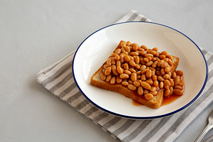 Homemade English Beans on Toast, side view., a Food & Drink Photo by LiudmylaChuhunova