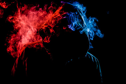 A young man  smokes a vape featuring smoke, man, and young, a Person Photo by Sova