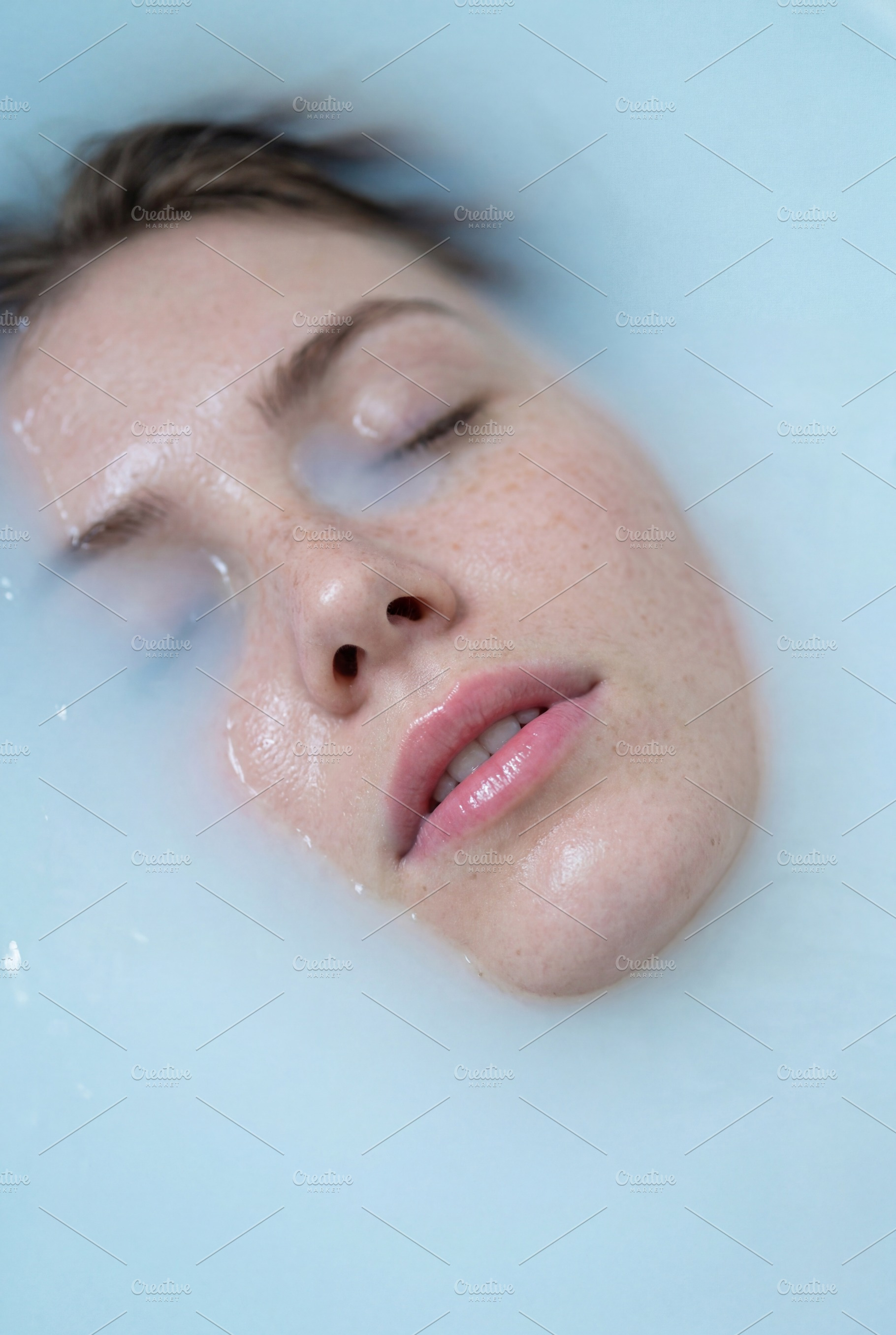 Serene Portrait of Freckled Woman, a Beauty & Fashion Photo by Virgo Studio
