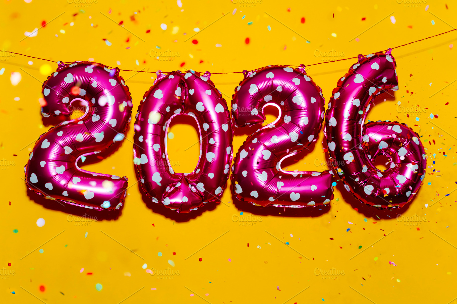 pink balloons show number 2026, as the new year, a Photo by Nito