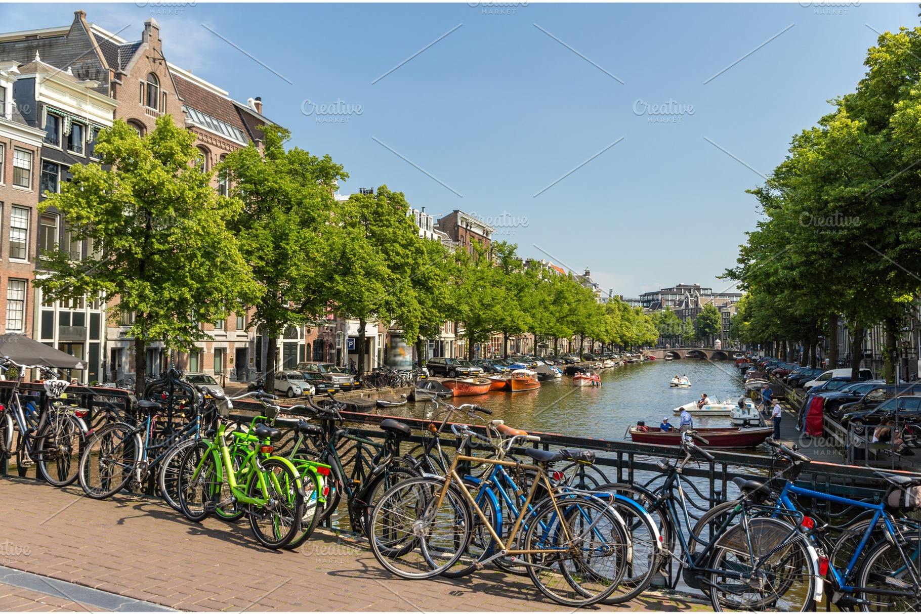 Traditional view of amsterdam bicycles and water featuring amsterdam, canal, an Architecture Photo by Leonid Andronov