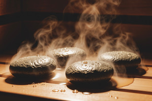 Extreme close-up of hot sauna stones, a Photo by rarrarorro