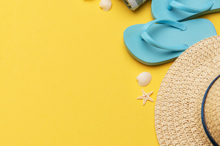 Summer holiday beach background with beach accessories and tropi