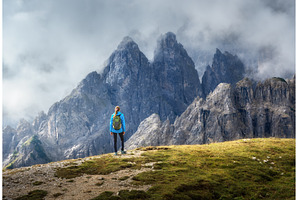 Female hiker admiring Dolomites, a Person Photo by den-belitsky