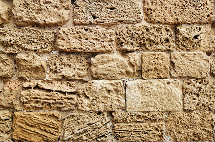Old natural limestone wall, a Background Photo by Elena Vagengeim