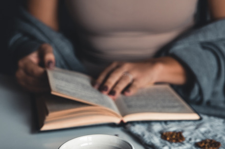 Woman reading a book and having brea, a School & Education Photo by OS