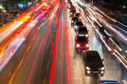 Light streams from ongoing traffic containing traffic, light, and street, a Transportation Photo by Casanowe-studio