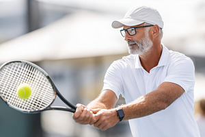 Active senior man playing tennis., a Sports & Recreation Photo by MistyDay