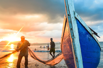Fisherman containing boat, catch, and ebb, a Nature Photo by bastera