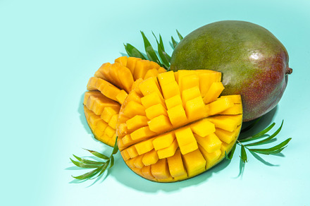 Fresh whole and sliced mango, a Food & Drink Photo by Rimma