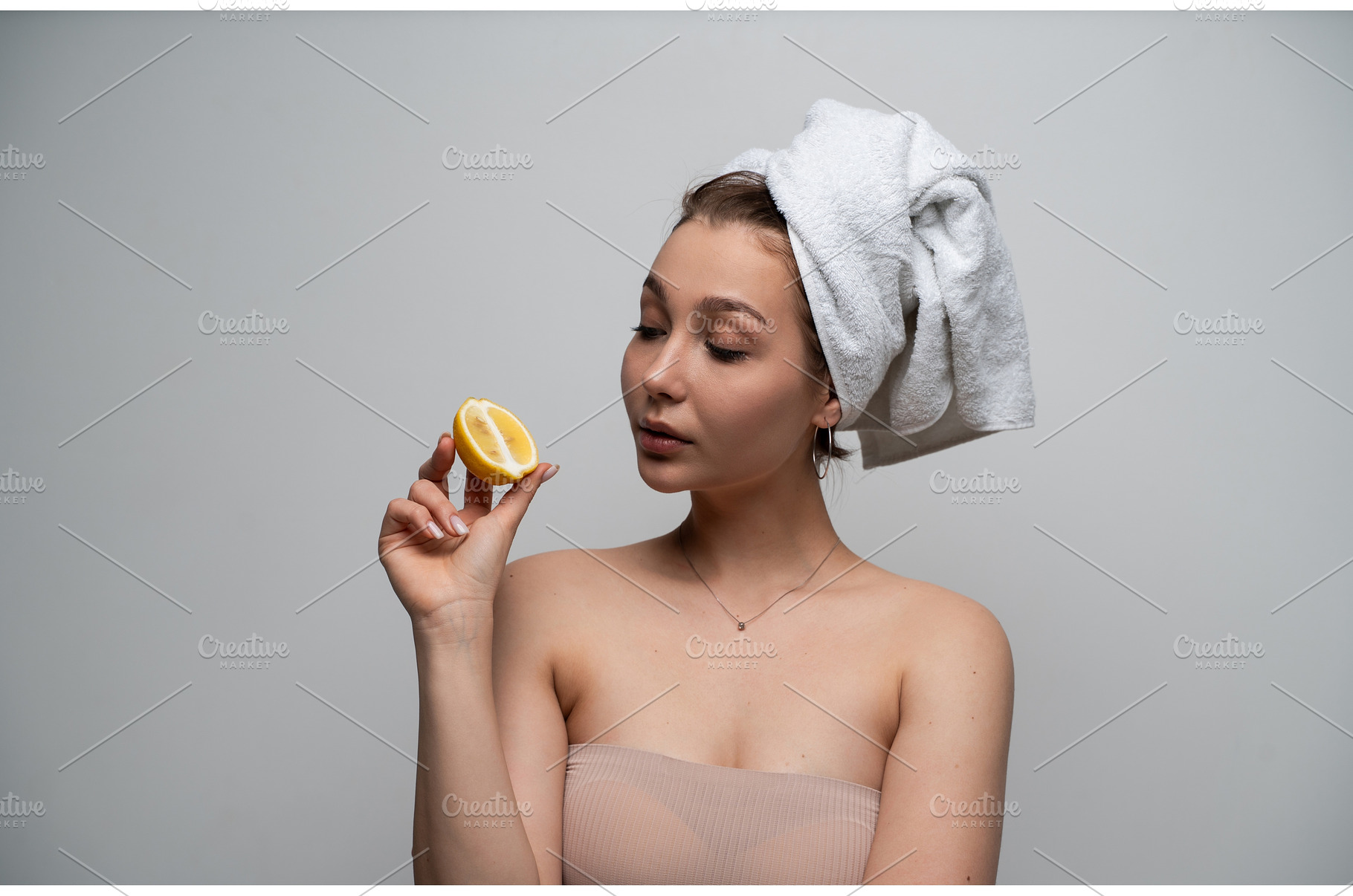 Woman with hair wrapped in a white, a Health & Medical Photo by volodymyrshtun13795