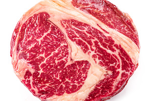 Raw ribeye steak isolated on white background., a Food & Drink Photo by Volff