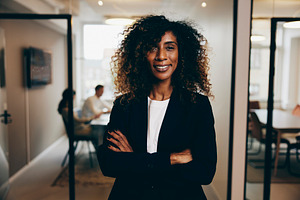 Businesswoman standing in an office and smiling