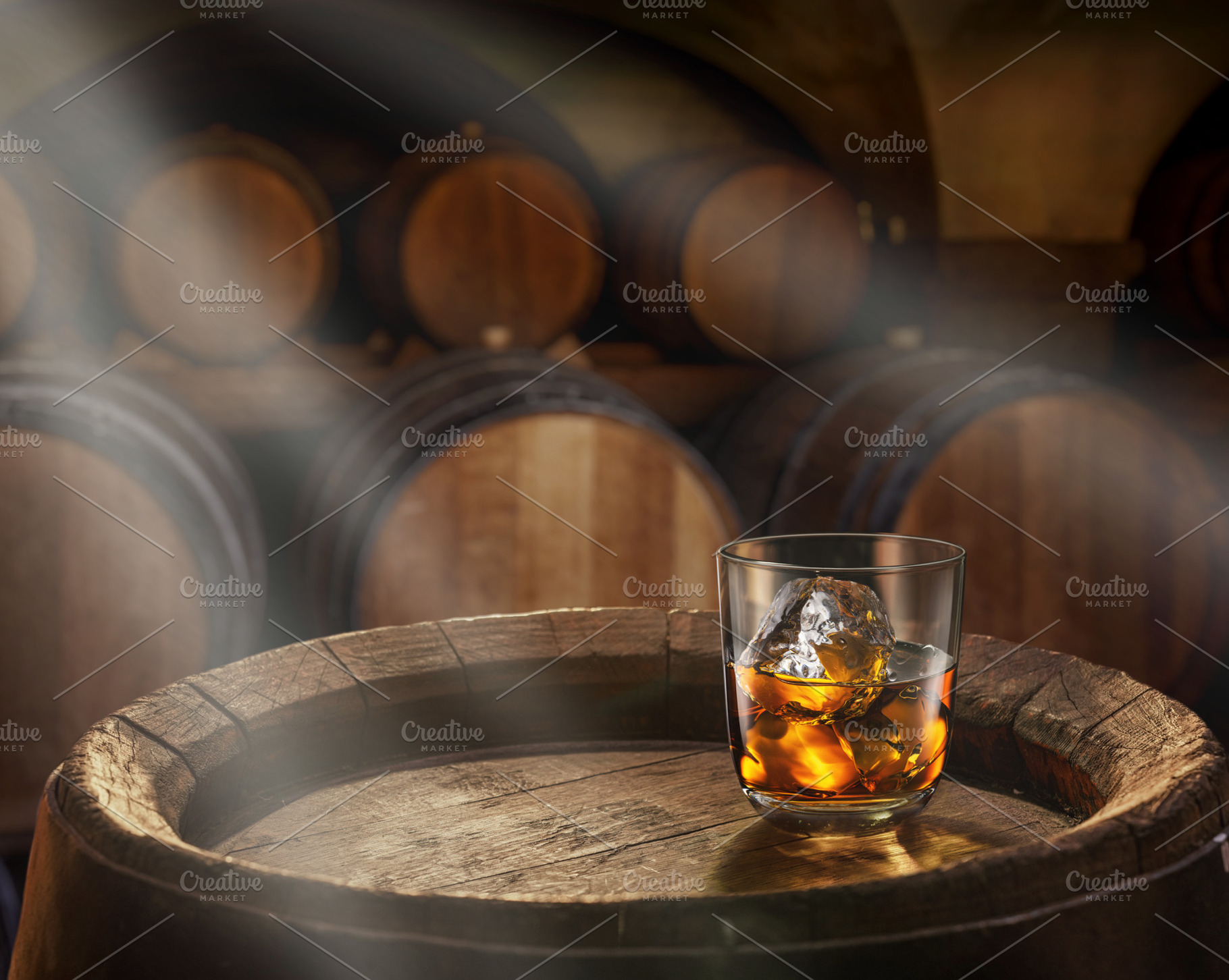 Glass of whiskey on top of barrel, a Food & Drink Photo by Volff