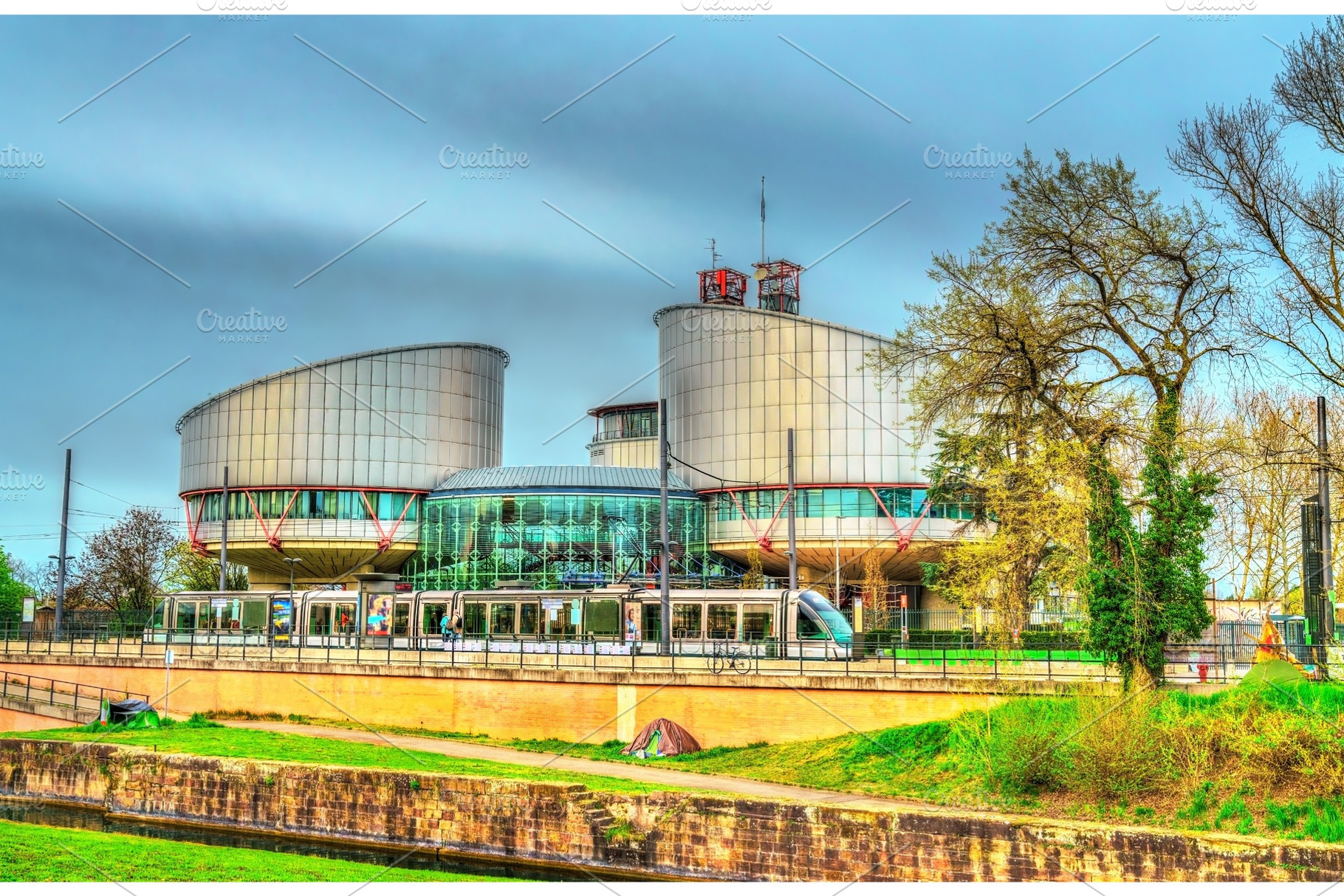 The European Court of Human Rights and a city tram in Strasbourg, France, an Architecture Photo by Leonid Andronov