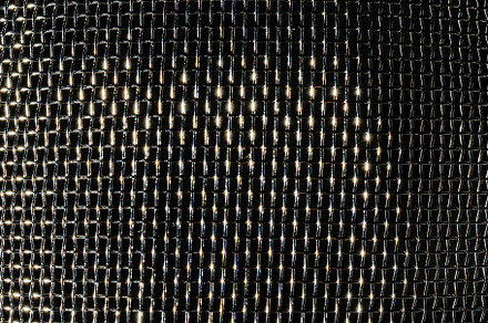 Monochrome texture of a shiny metal colander or grate. Abstract, an Abstract Photo by Eugene_Photo