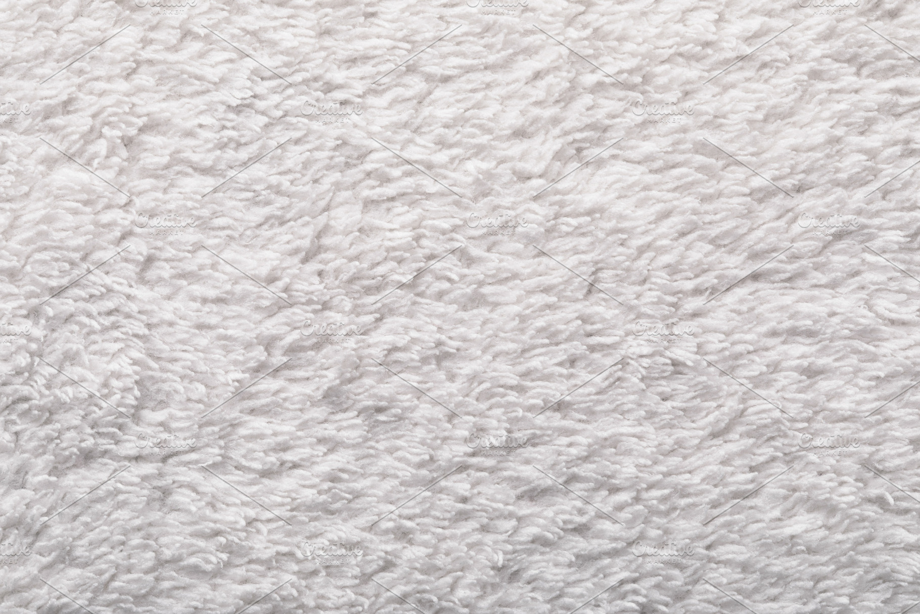 Close-up of soft white towel fabric with fluffy texture, perfect, a Background Photo by Ales Munt