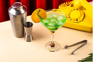Retro green cocktail against a red, a Food & Drink Photo by Yulia Furman