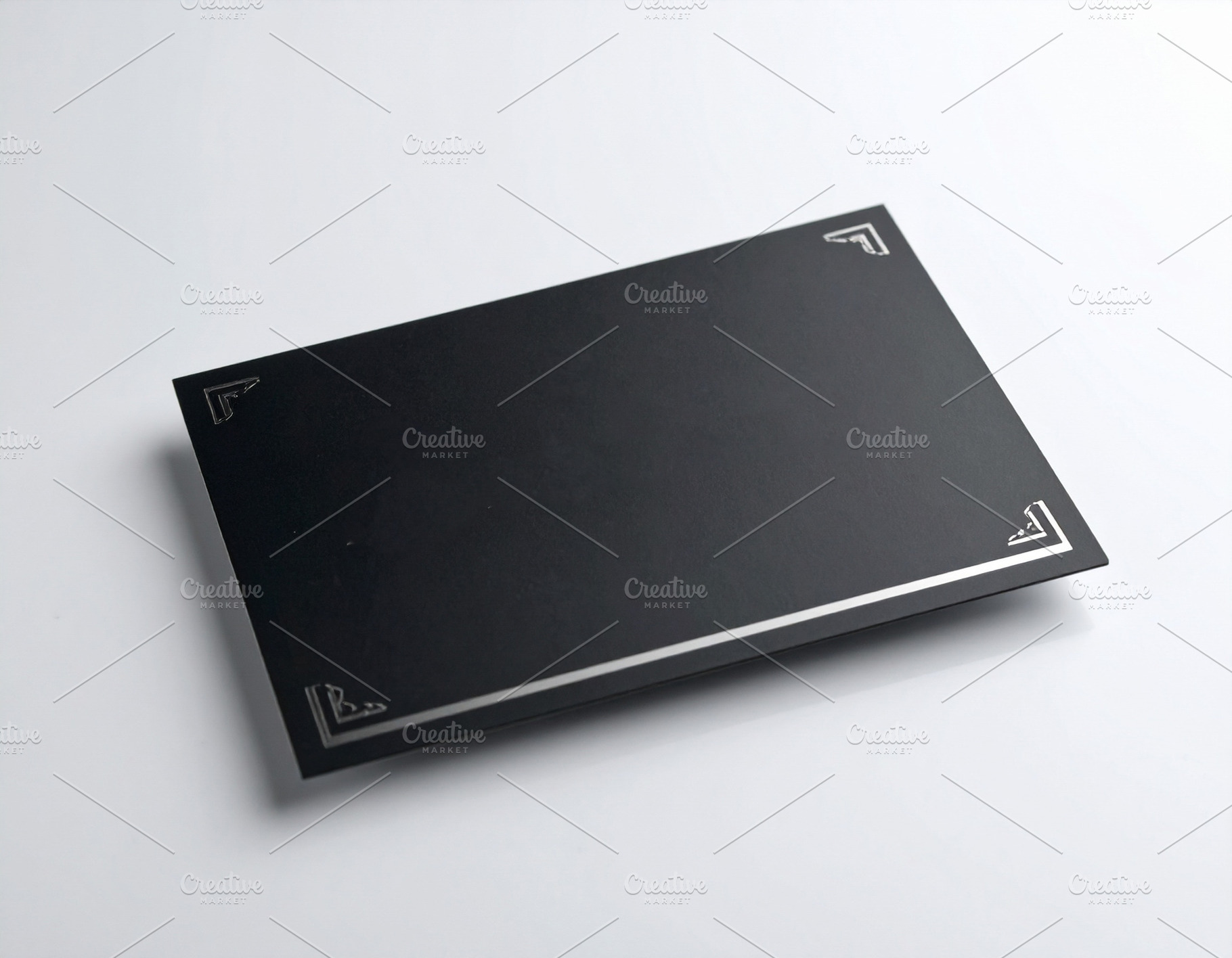 Modern black business card centered on a white desk, a Business Photo by DanFLCreativo