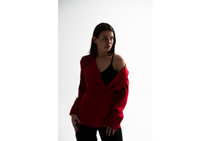 Young woman styling a red blazer, a Person Photo by volodymyrshtun13795