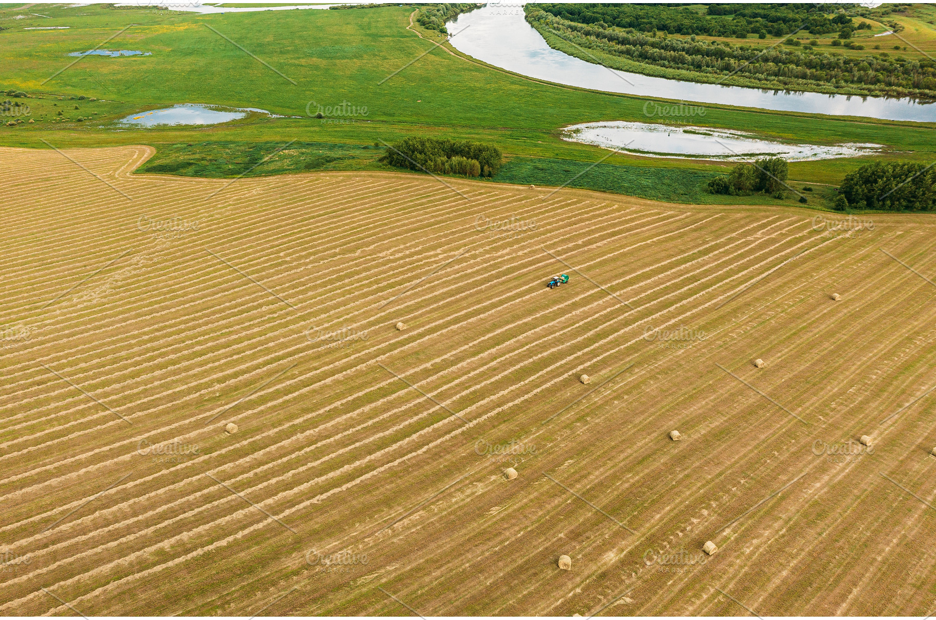 Aerial View Tractor Collects Dry, an Industrial Photo by Our Amazing World