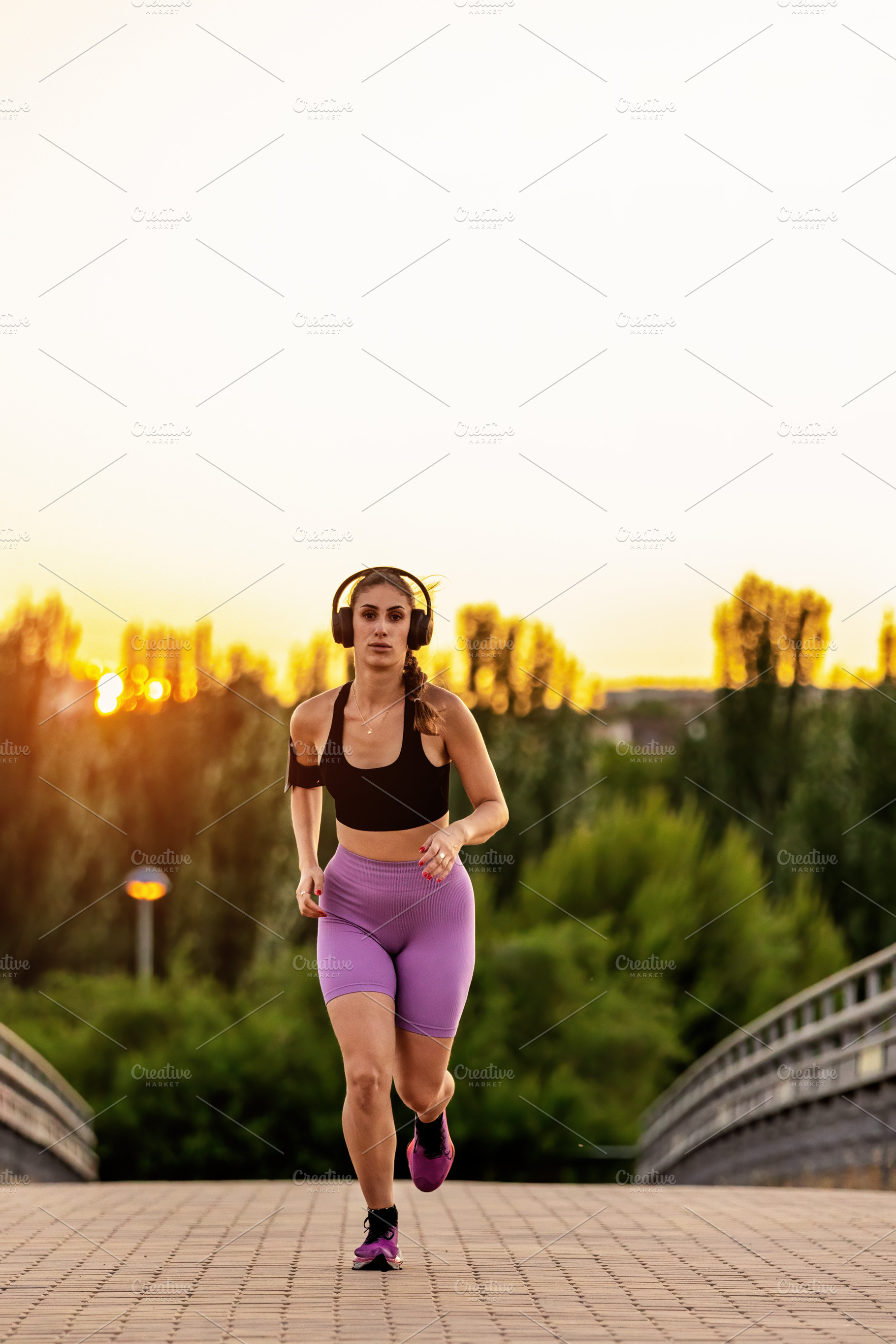 Young woman running at sunset with h, a Sports & Recreation Photo by Perpis