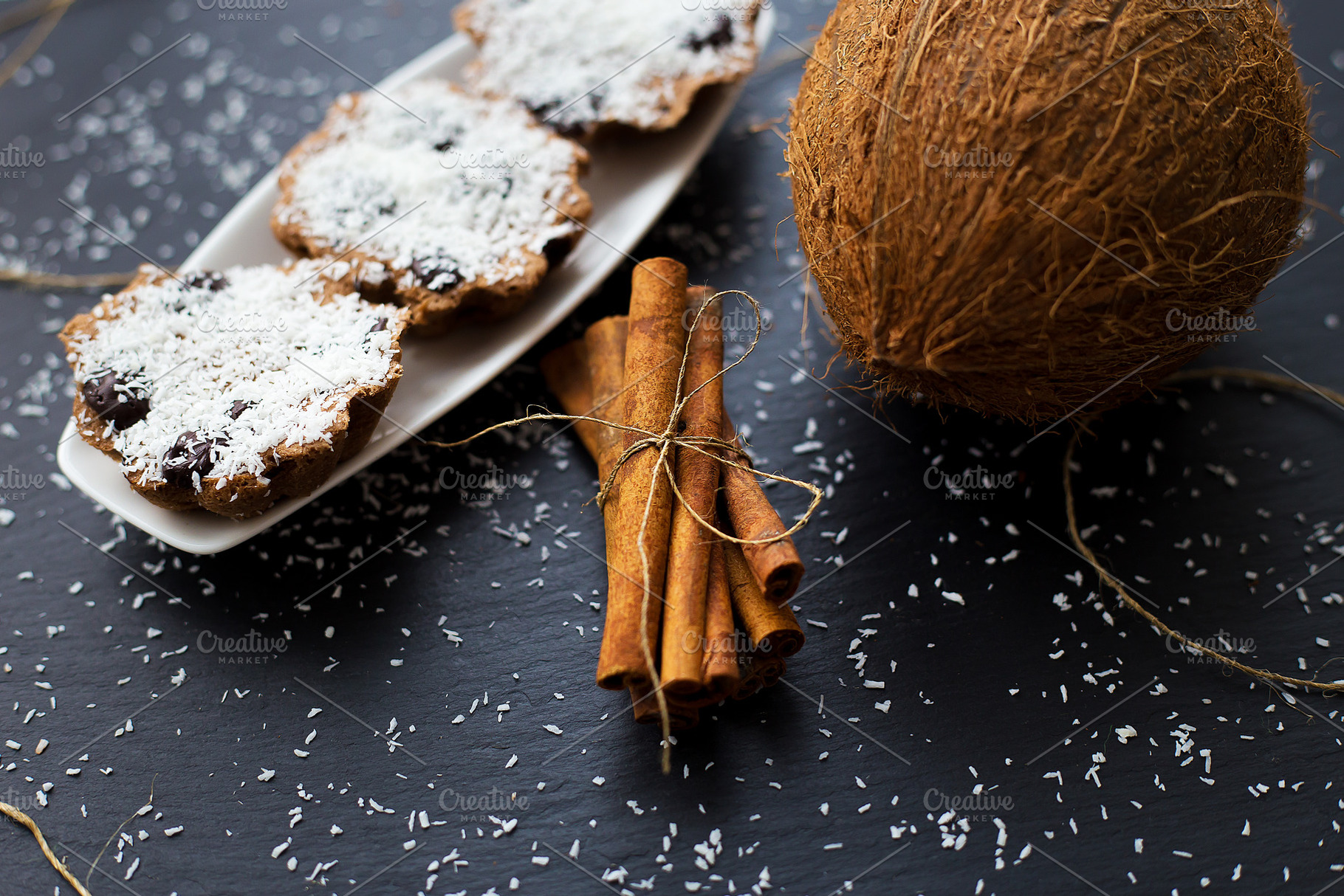 coconut muffins on a black background, a Food & Drink Photo by Artsaba Family