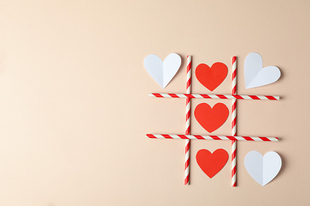 Valentine's Day concept with tic tac toe on beige background, an Arts & Entertainment Photo by AtlasStudio PRO