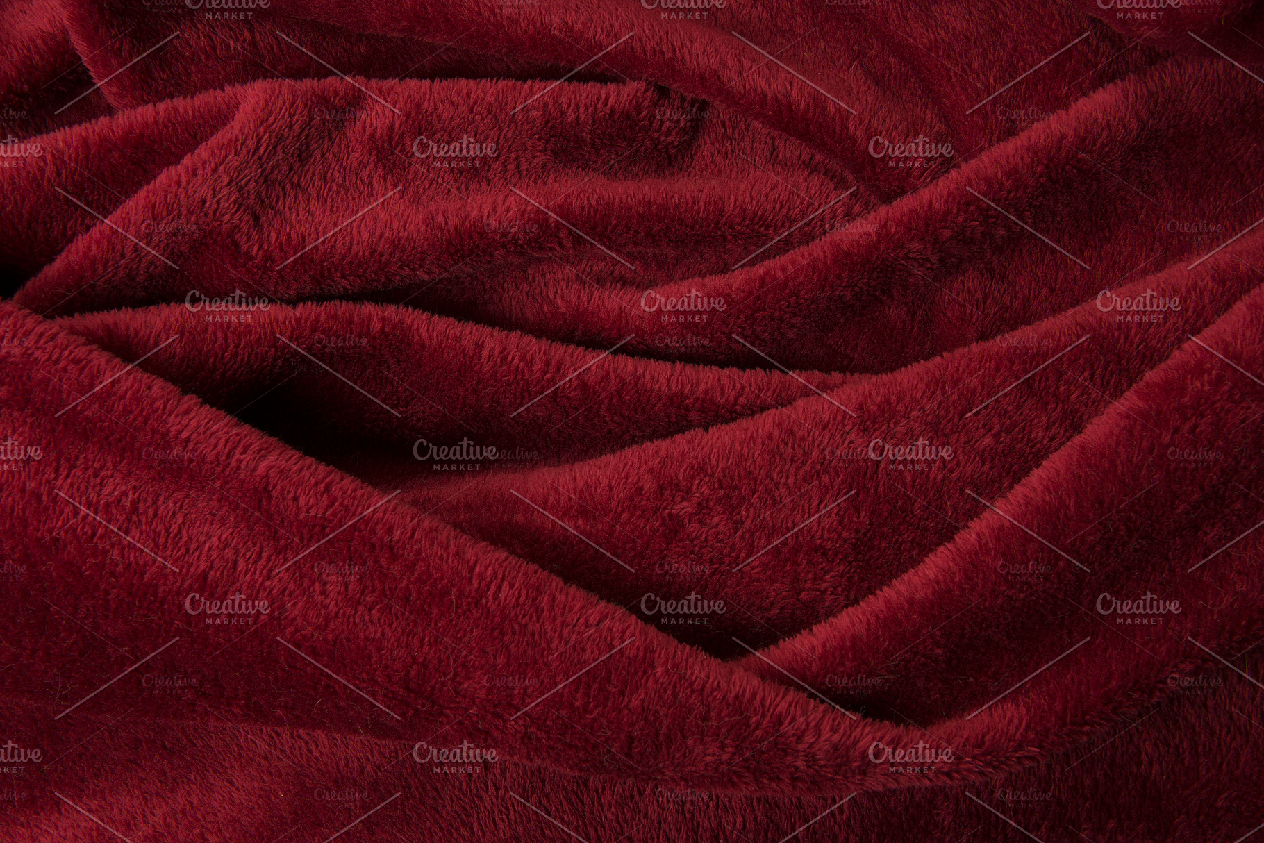 Full-frame burgundy red velvet cloth, an Abstract Photo by Elles Rijsdijk