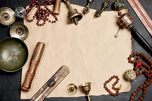 Religious objects for prayer and meditation, with a sheet of bro, an Abstract Photo by ndanko