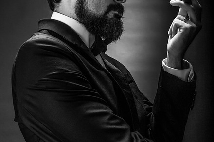 Smoking gentleman portrait containing adult, attractive, and background, a Person Photo by Ales Munt