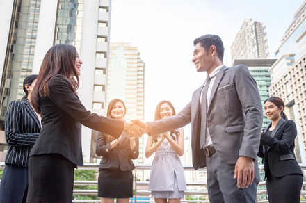 Businessmen shake hands to reach business agreement together, Bu, a Person Photo by Ministocker