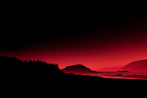 Dramatic red sunset over ocean coast, a Nature Photo by MistyDay