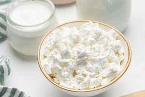 Fresh dairy products showing cottage cheese, milk, and butter, a Food & Drink Photo by Olena Rudo