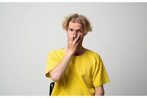 Young blond man expressing shock and, a Person Photo by volodymyrshtun13795