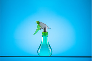 Spray bottle on a blue background, a Nature Photo by Stockphoto by vzwer