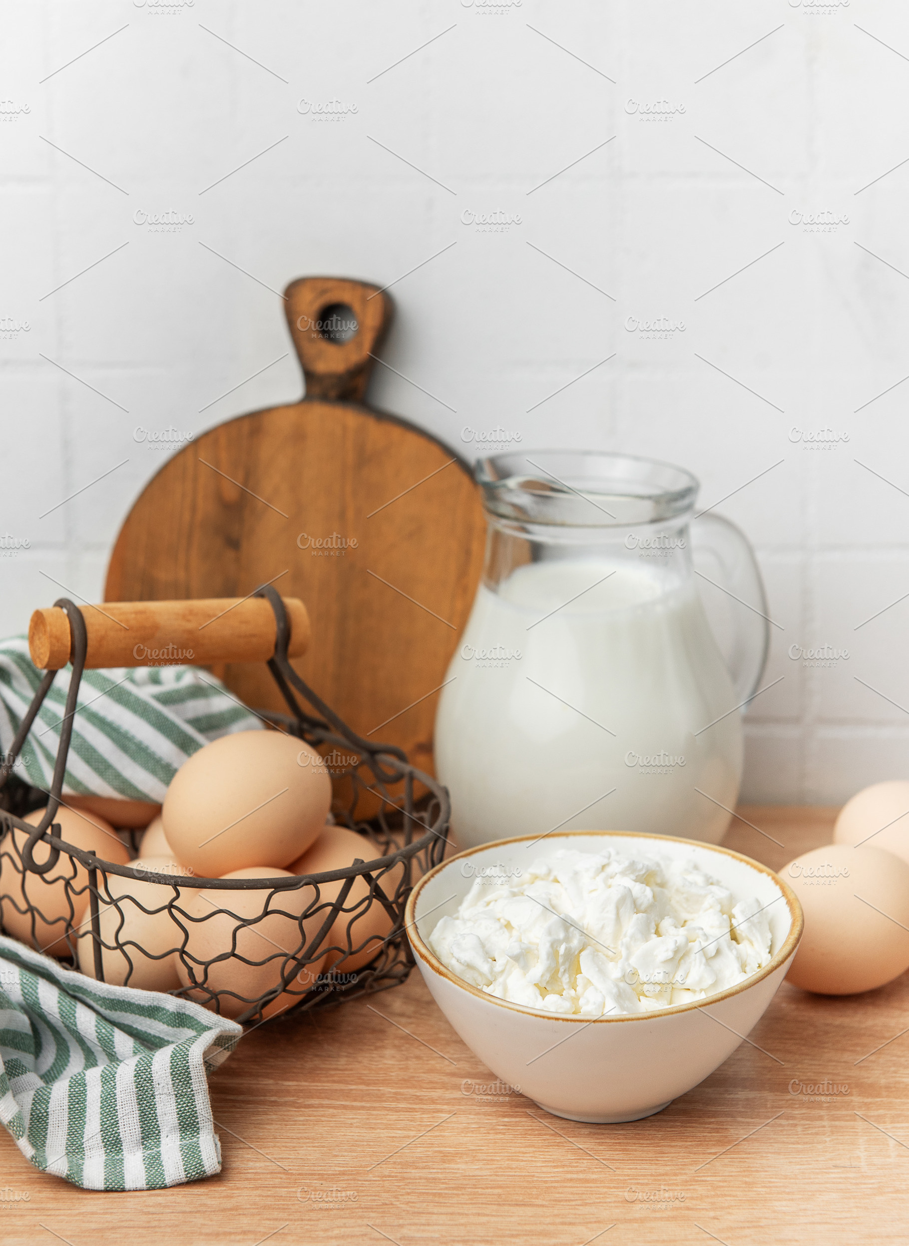 Fresh raw dairy products preparing healthy breakfast, a Food & Drink Photo by Olena Rudo