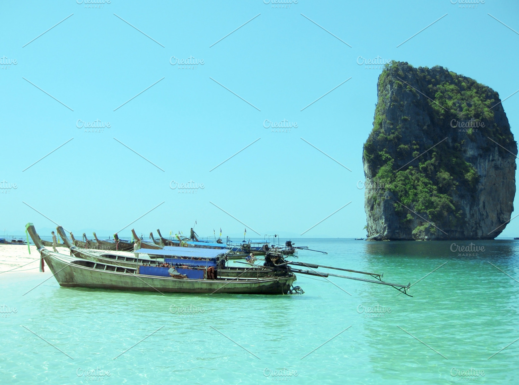 Long Tailed Boats At An Island