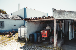 Vintage red tractor on farm, an Industrial Photo by SkyNext